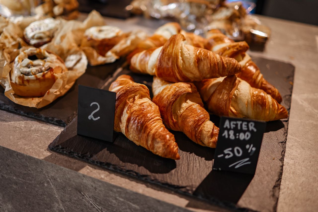 Crafting Captivating Headlines: Your awesome post title goes here Freshly baked croissants displayed on a slate board, enticing breakfast lovers.