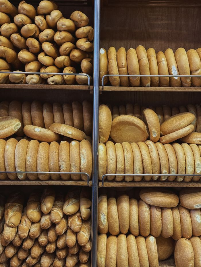 The Art of Drawing Readers In: Your attractive post title goes here Assorted fresh breads neatly displayed in bakery shelves, ready to enjoy.